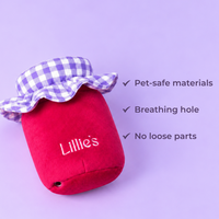 Back of the Cherry Jam toy with the embroidered Lillie's logo and the breathing hole. Pet-safe materials, breathing hole, no loose parts