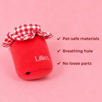 Back of the Strawberry Jam toy with the embroidered Lillie's logo and the breathing hole. Pet-safe materials, breathing hole, no loose parts